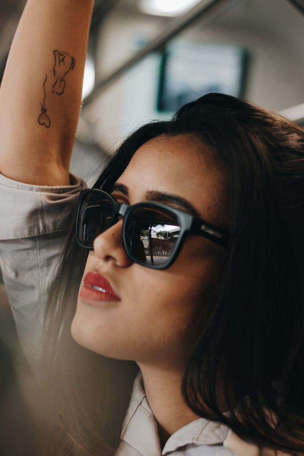 woman in black sunglasses and white shirt