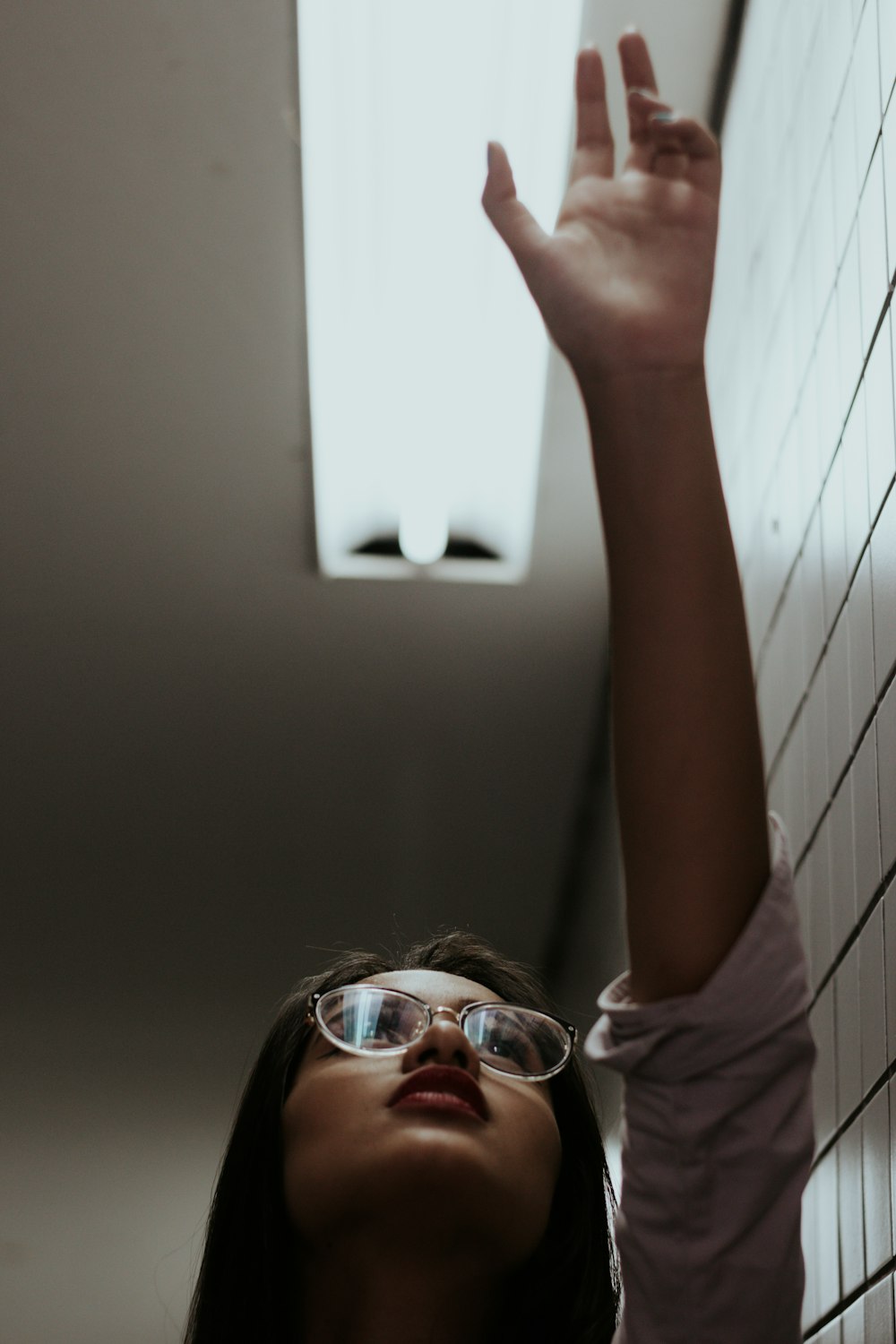 woman in white shirt wearing sunglasses