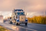 white and blue truck on road during daytime