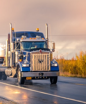 white and blue truck on road during daytime