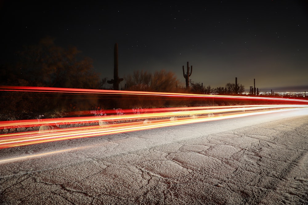 time lapse photography of cars on road during night time