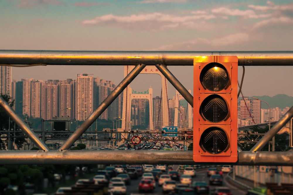 yellow and black traffic light on city during daytime