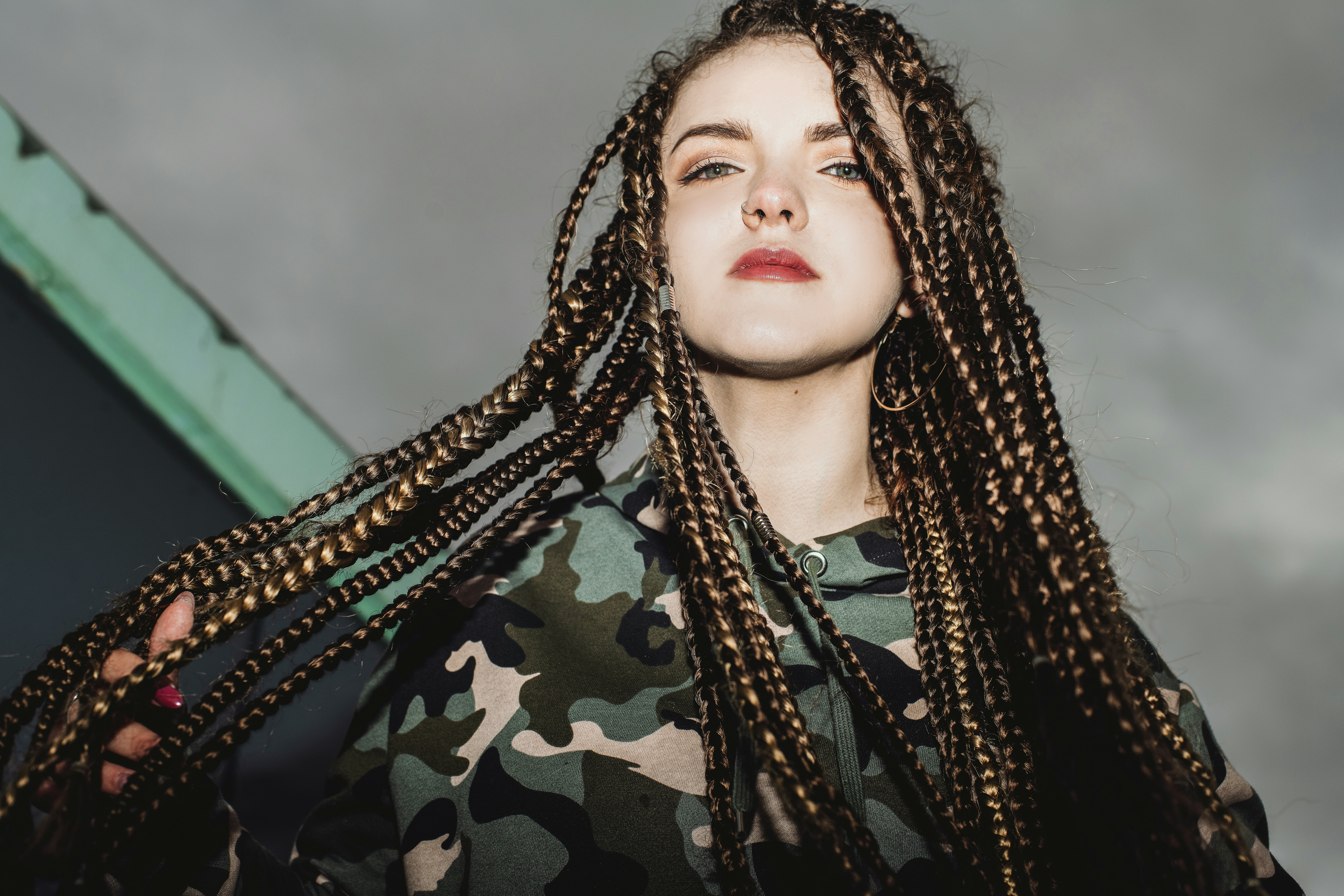 woman in black and green camouflage shirt