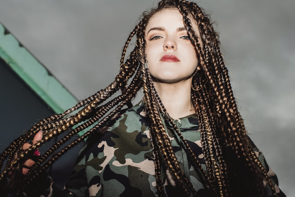 woman in black and green camouflage shirt