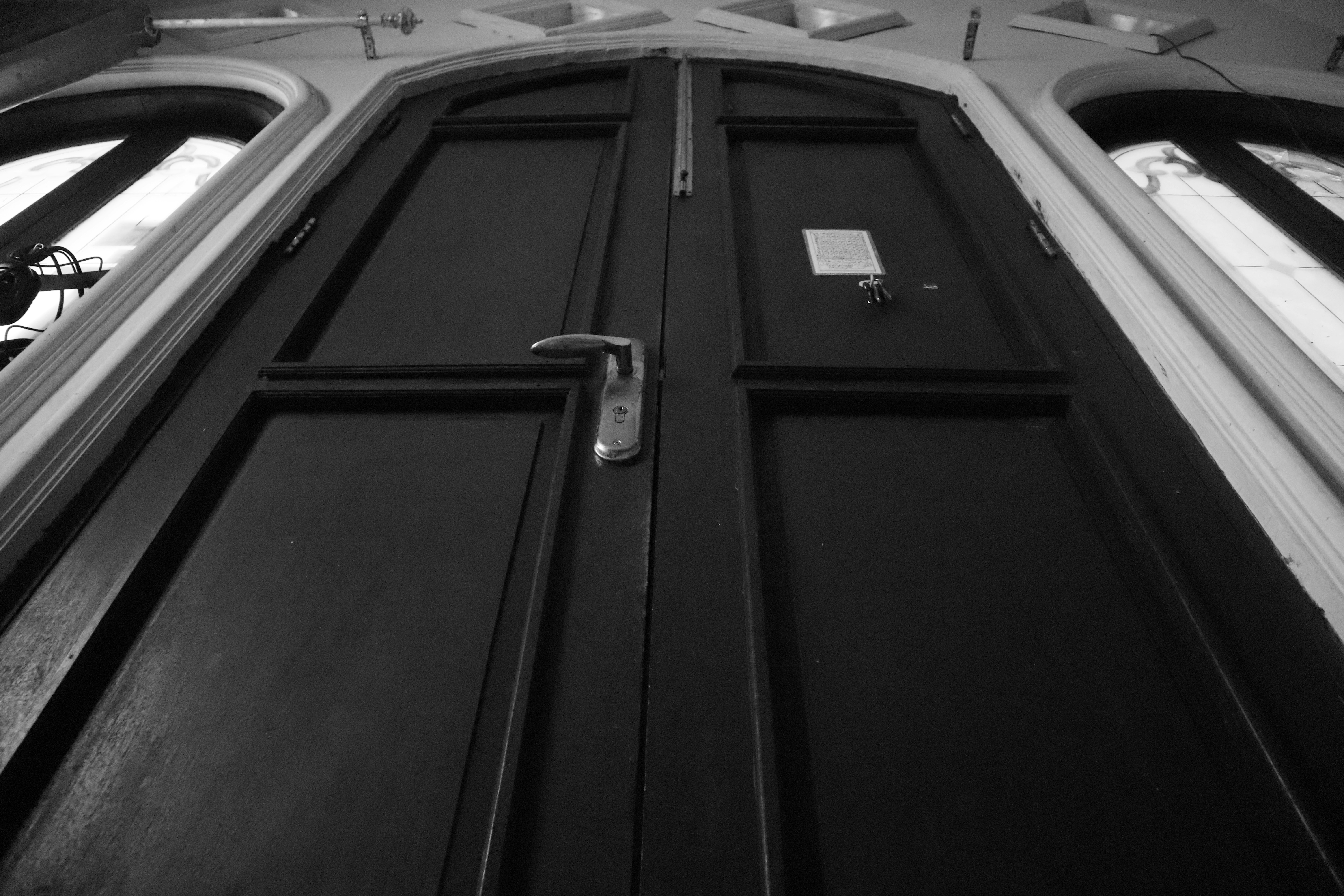 a black and white photo of a door