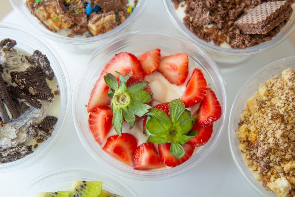 sliced strawberries on clear plastic container