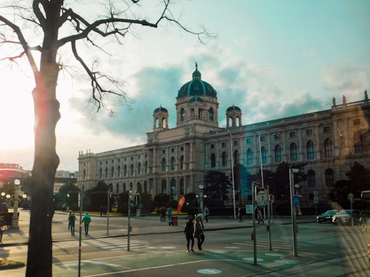 people walking near white concrete building during daytime in Mária Terézia tér Austria