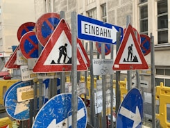 blue white and red arrow sign