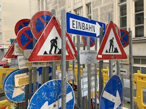 blue white and red arrow sign
