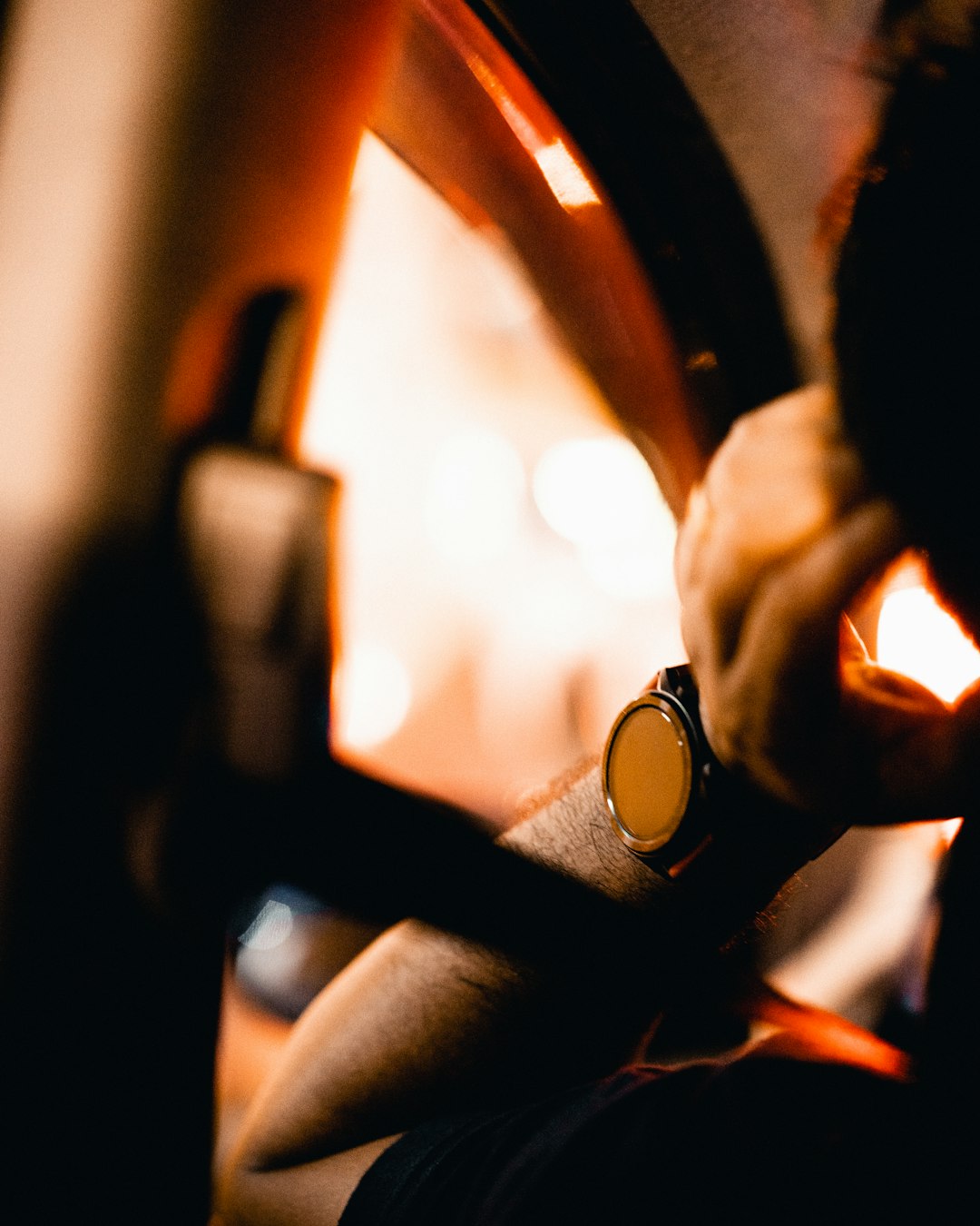 person holding black steering wheel