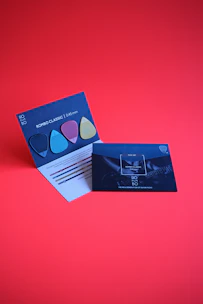 A bold red and black card with unlimited music notes illustrating the Premium Plan.