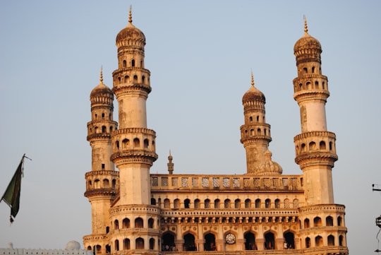 brown concrete building under white sky during daytime in Charminar India