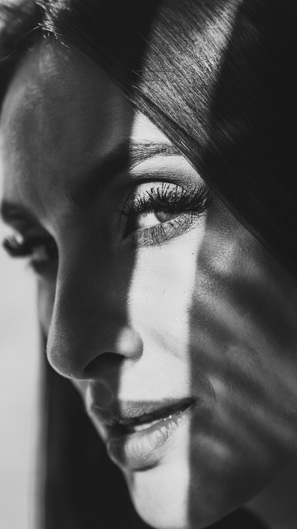 grayscale photo of womans face