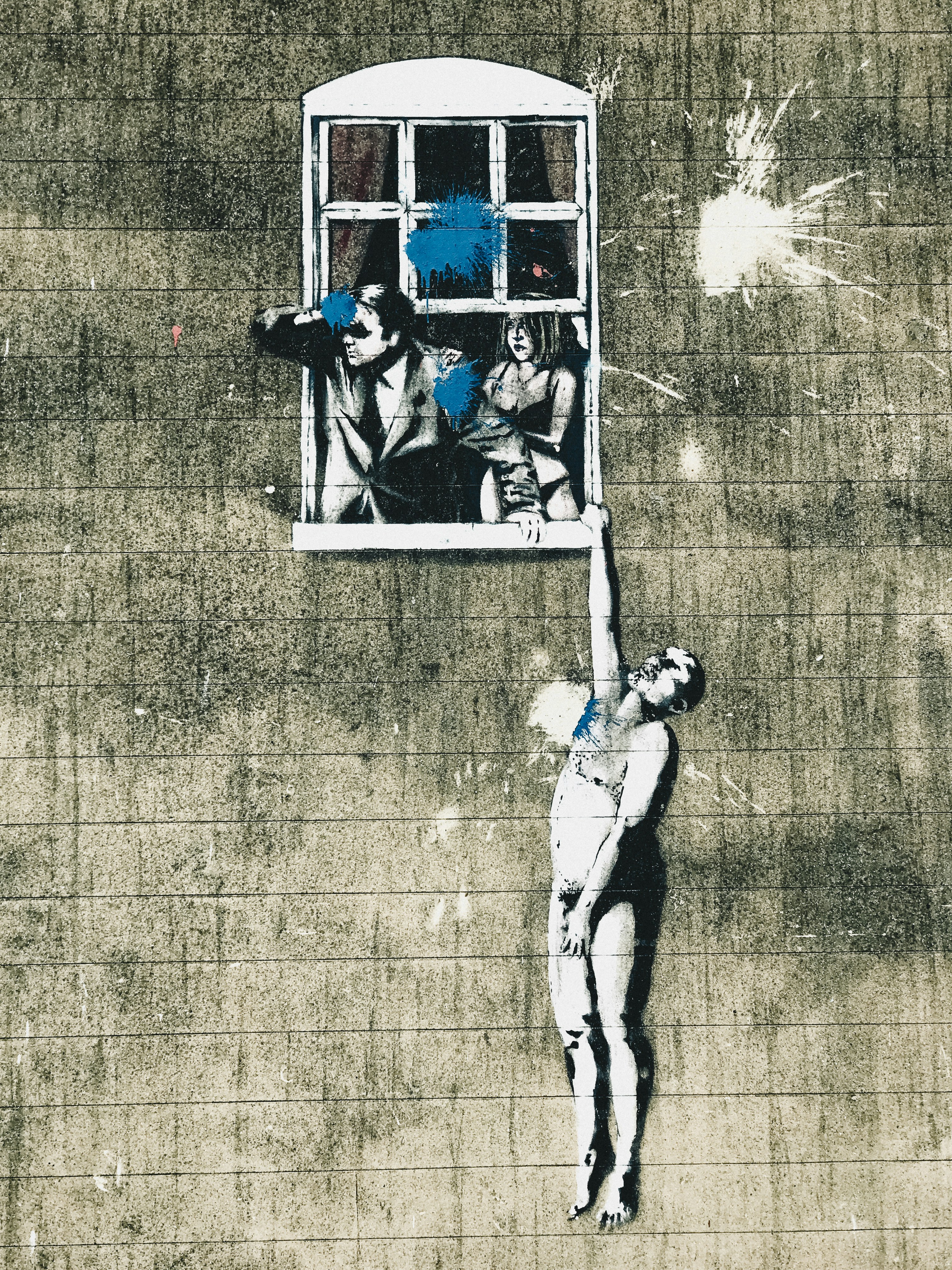 2 men and woman standing on brown concrete floor