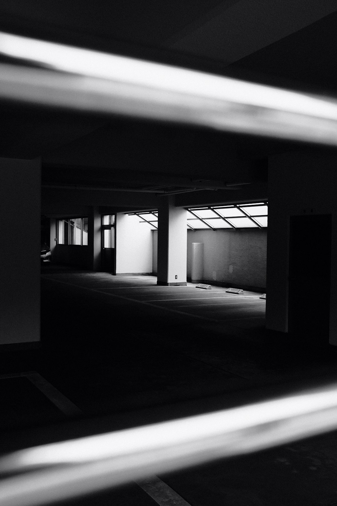 grayscale photo of empty hallway