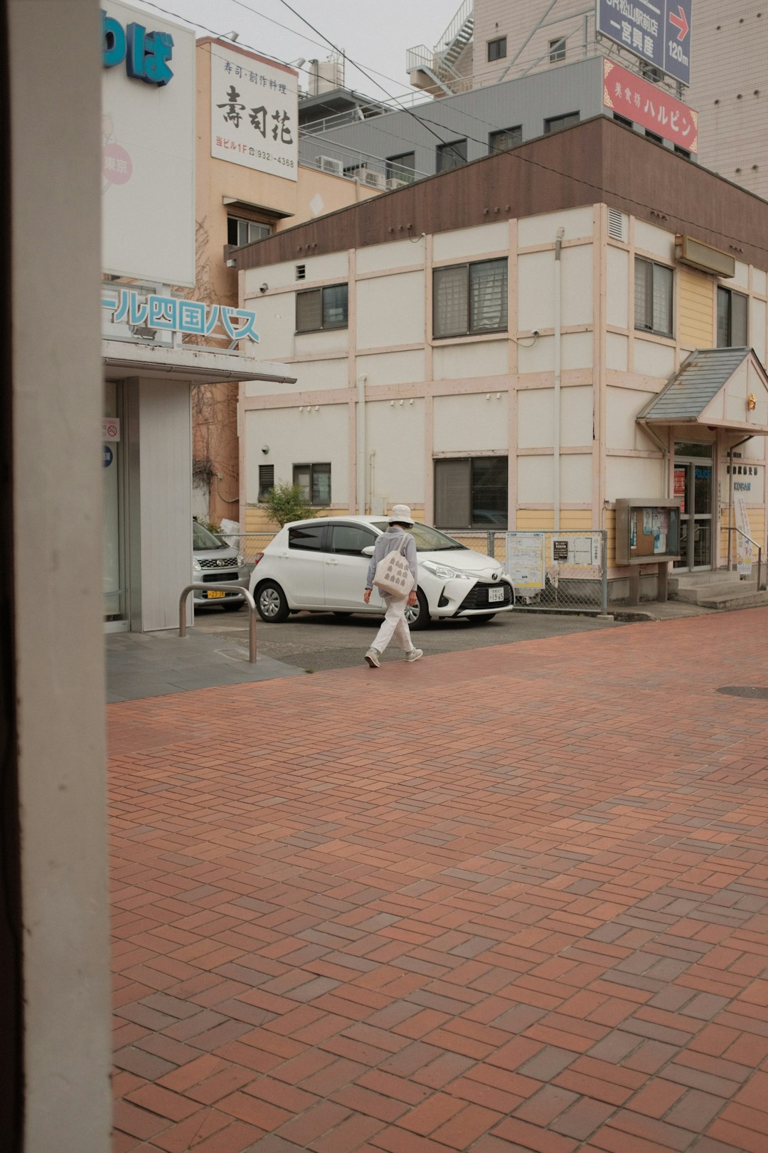 white suv parked beside white suv during daytime