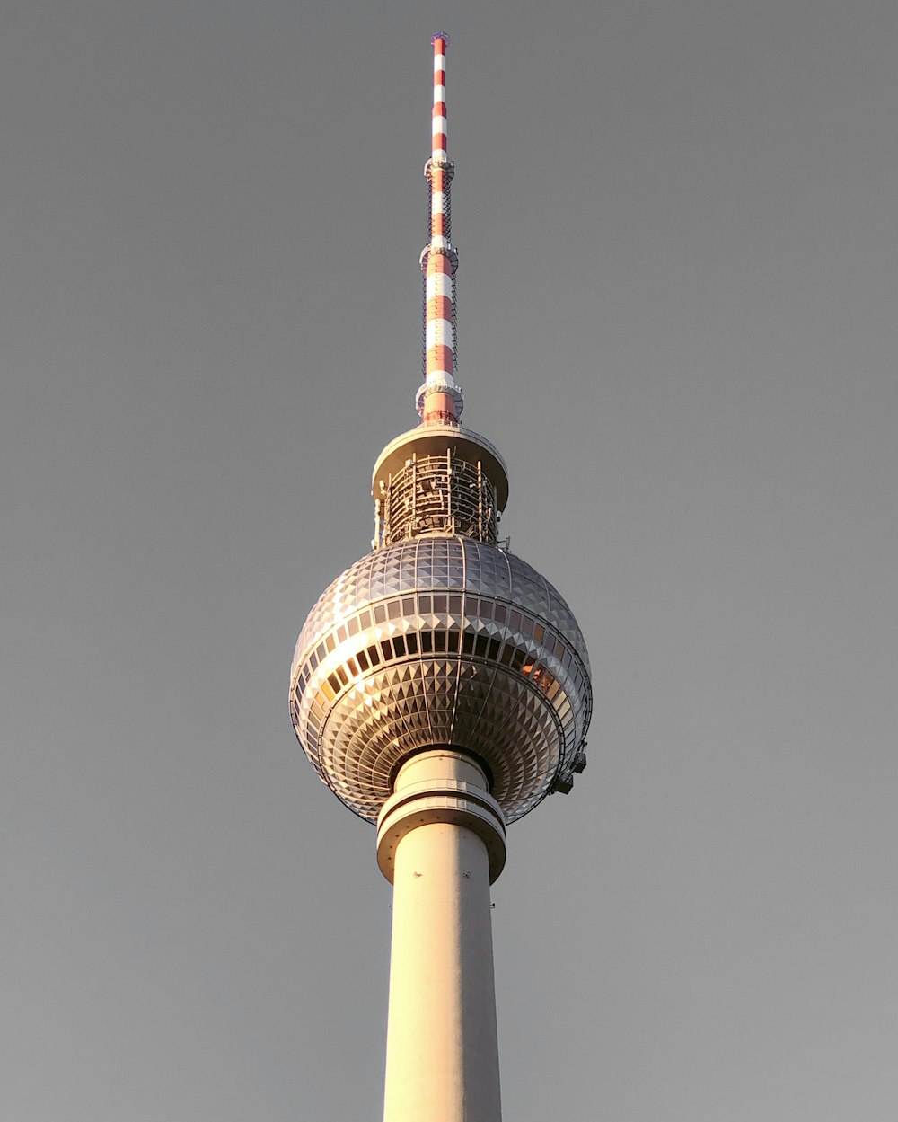 white and brown tower under gray sky