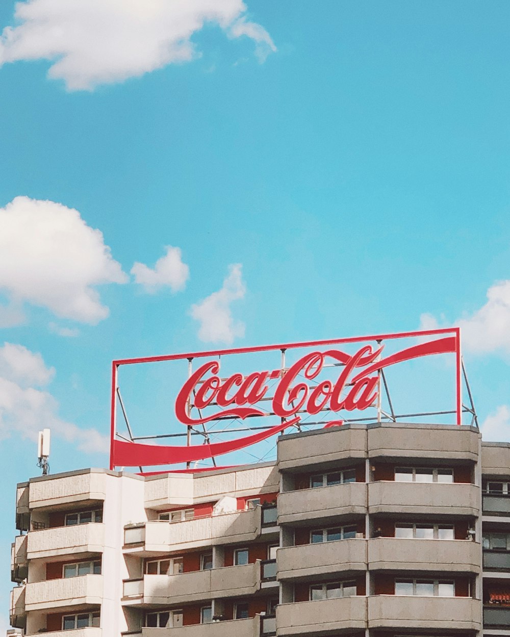 red and white coca cola signage