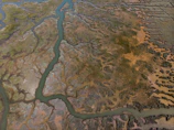 Aerial view of a wetland restoration project blending architecture with natural water flows.