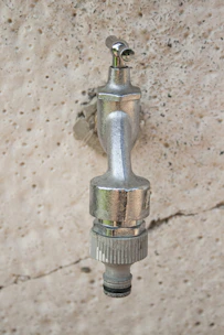 A shiny internal fire tap installed neatly on a wall.