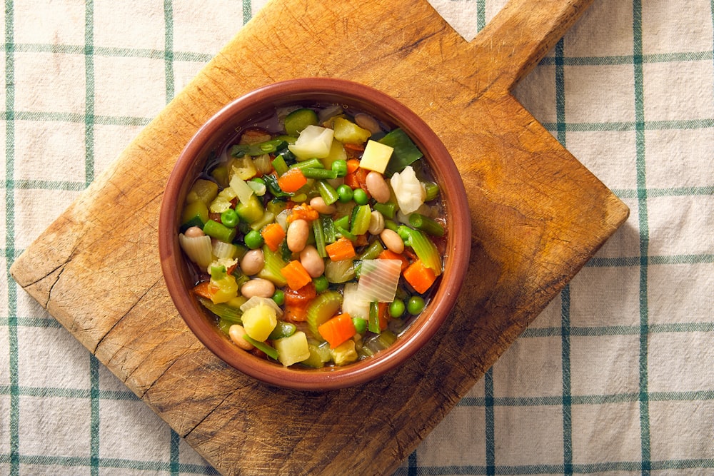 sliced vegetables in brown wooden bowl