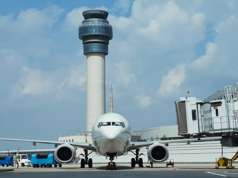 white passenger plane on airport during daytime