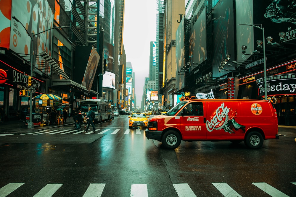 red and white coca cola truck on road during daytime