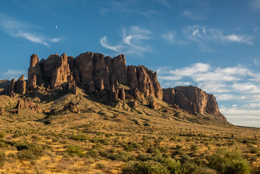 brown rocky mountain under blue sky during daytime