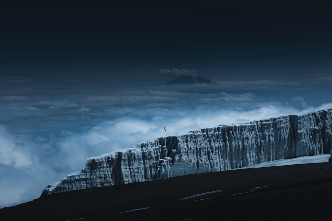 white clouds over snow covered mountain, Glacier on Kilimanjaro