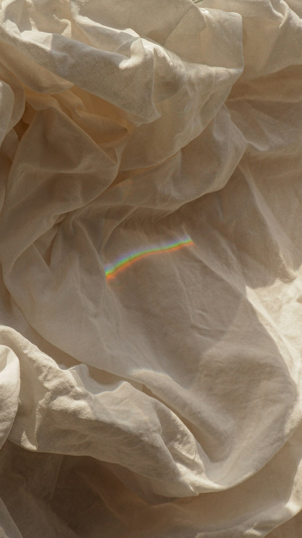 white textile on white textile