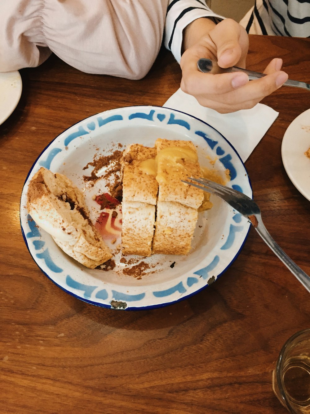 bread on blue and white ceramic plate