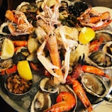 A beautifully arranged seafood platter with various items.