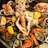 A happy customer with a seafood platter.