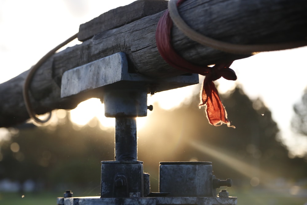 red rope on brown wooden post