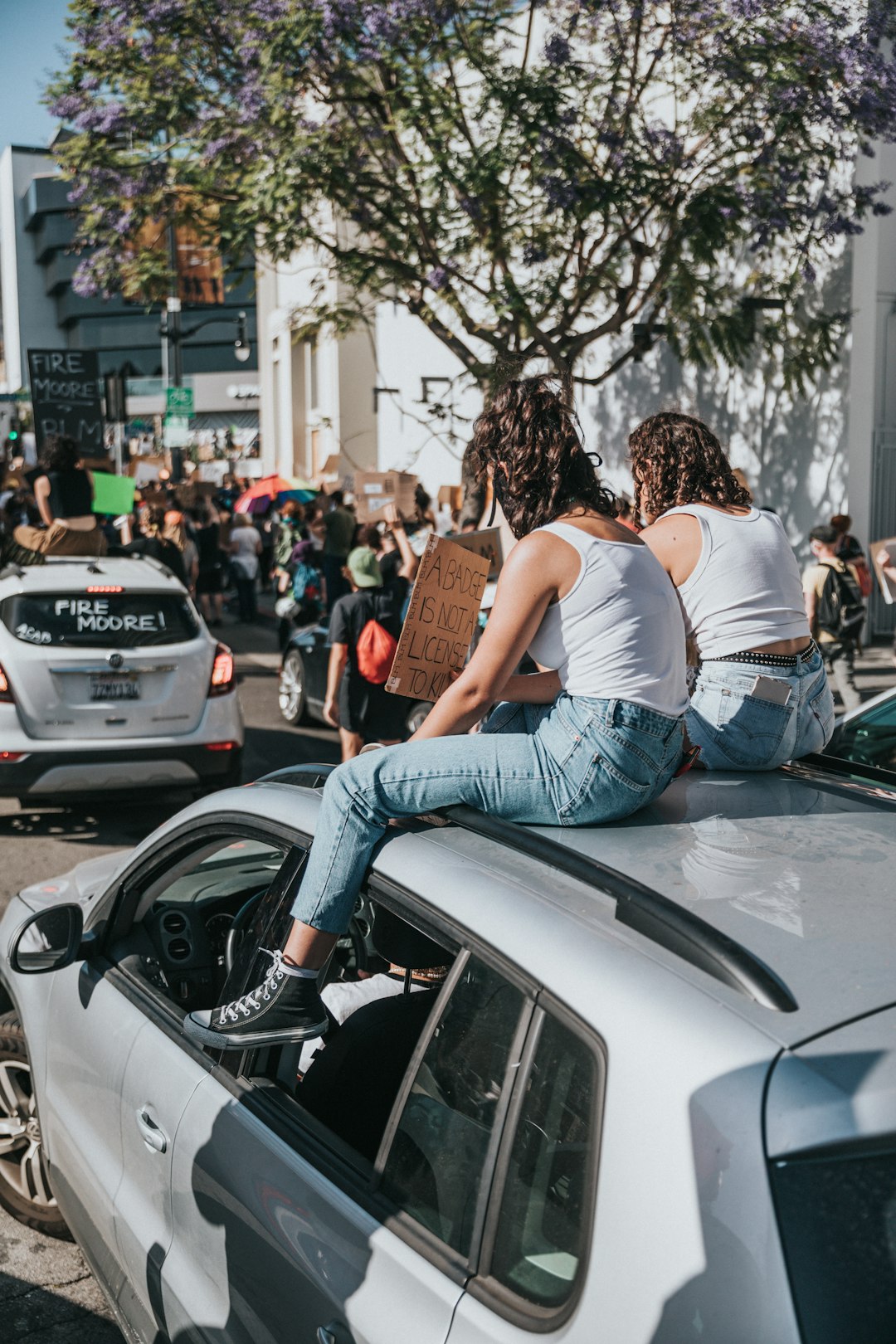 couple kissing on the street during daytime