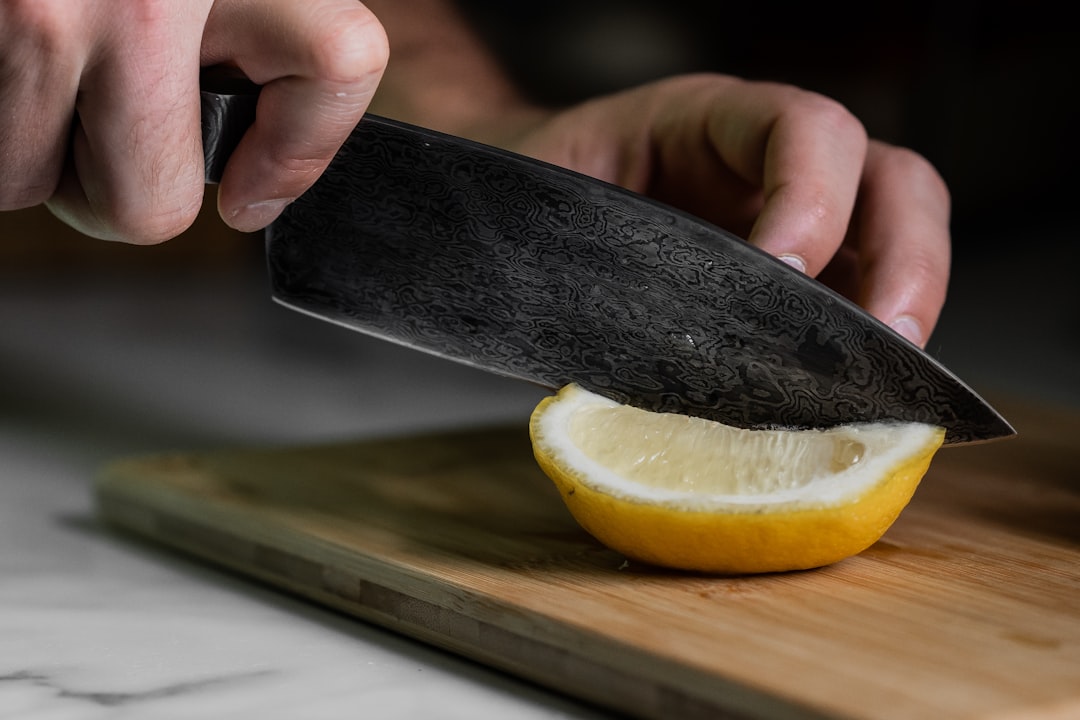 person holding sliced lemon fruit