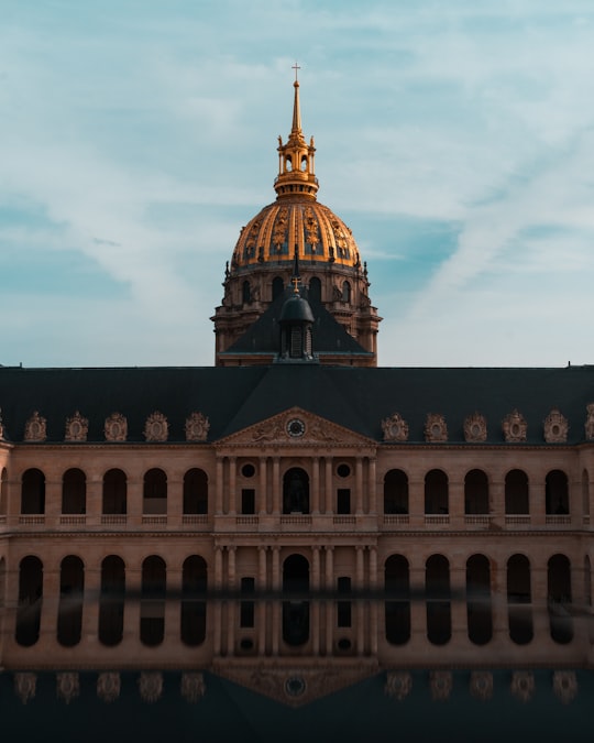 brown concrete building under white clouds during daytime in Les Invalides France