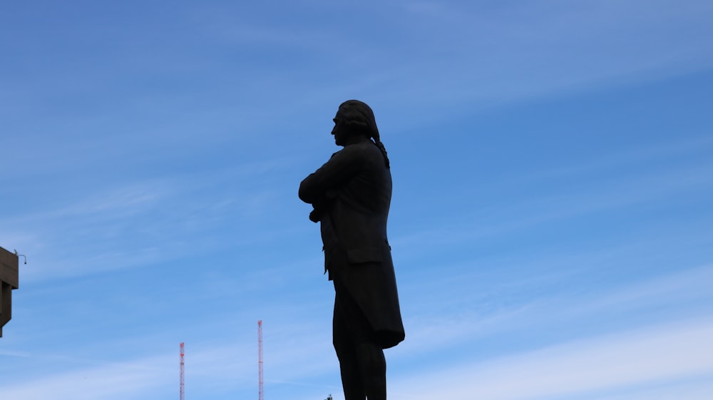 man in black suit statue