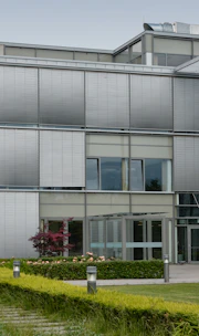 red flowers beside glass building