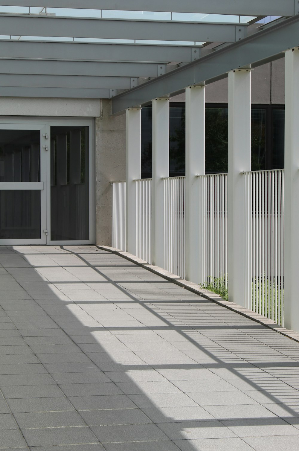 white wooden fence near white concrete building during daytime