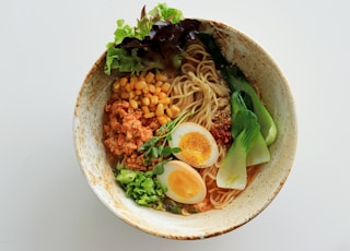 white ceramic bowl with rice and sliced lemon