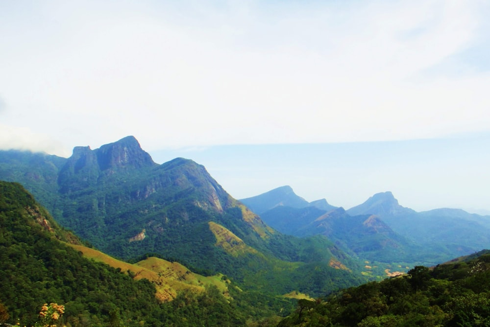 green mountains under white sky during daytime