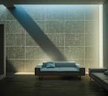 Modern living room with blue accent walls and minimalist furniture