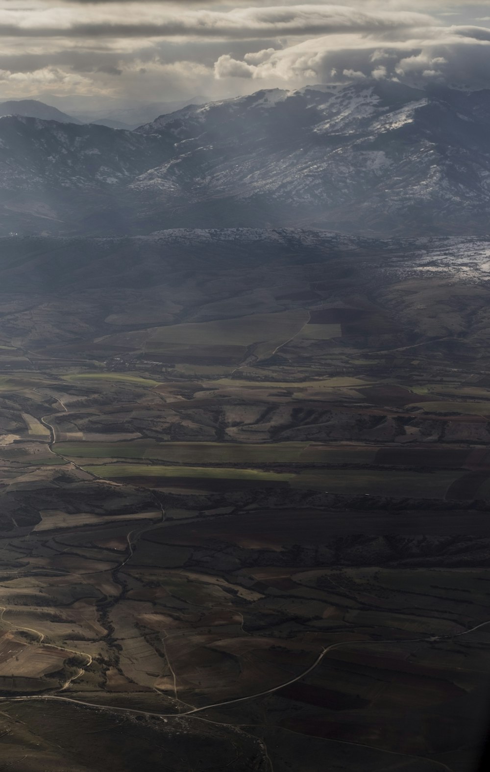 aerial view of green and brown mountains during daytime