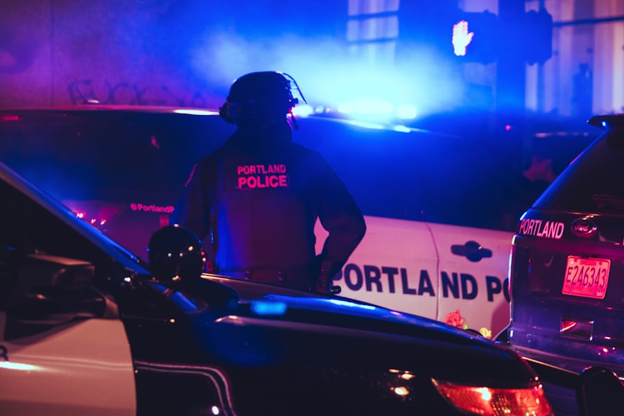 Police at a racial justice protest in Portland, Oregon, in June 2020 (Tito Texidor III via Unsplash)