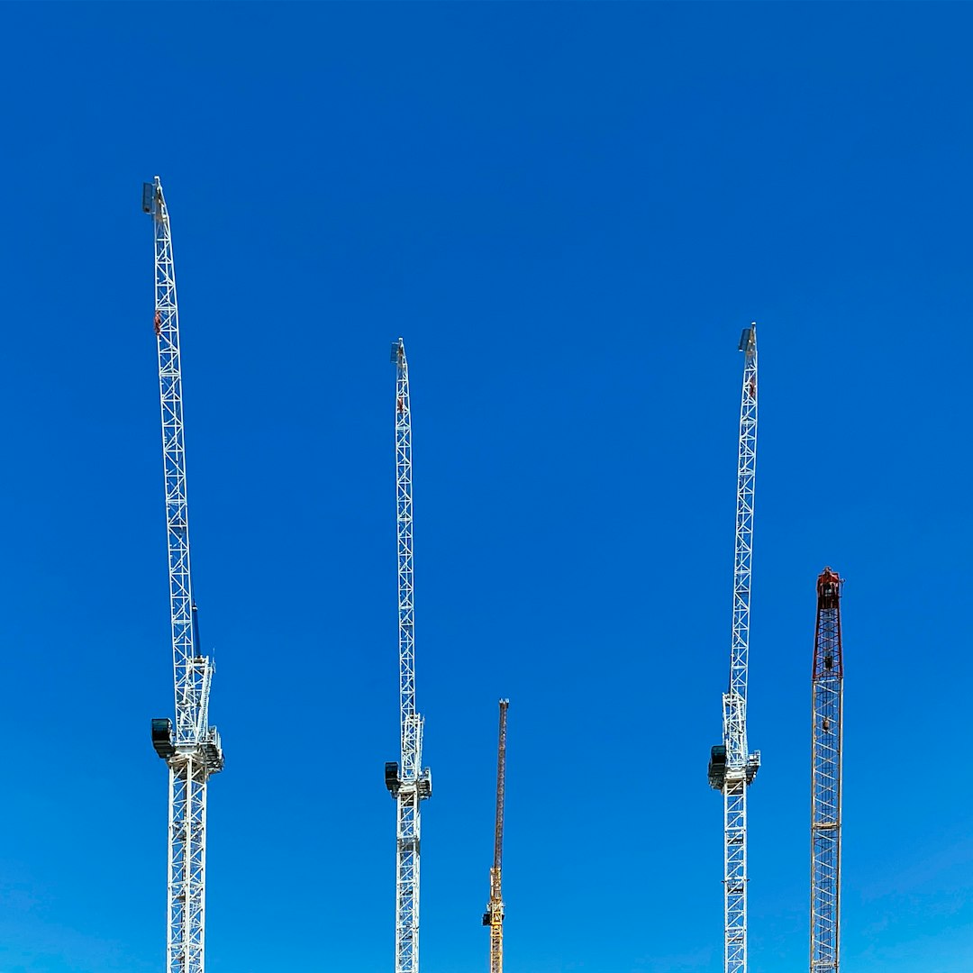 white metal towers under blue sky during daytime