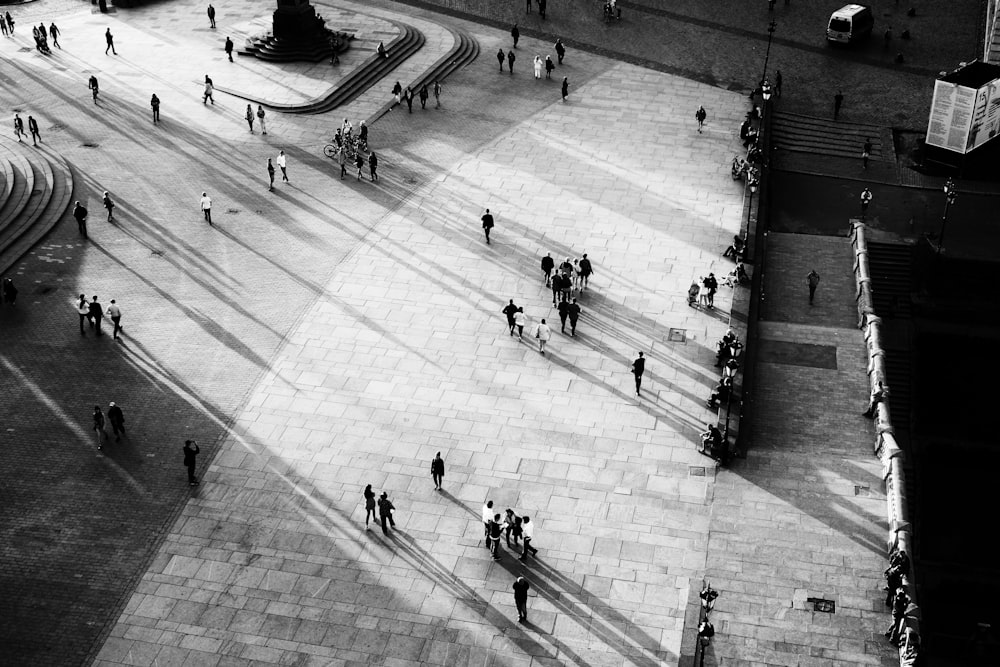 people walking on white floor tiles