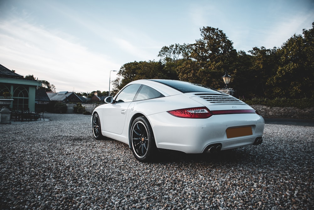 white mercedes benz coupe on gray concrete road during daytime