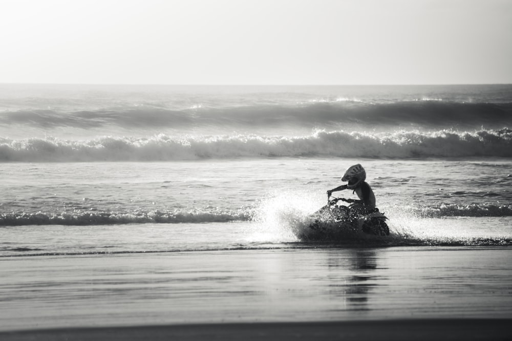 man surfing on sea waves during daytime