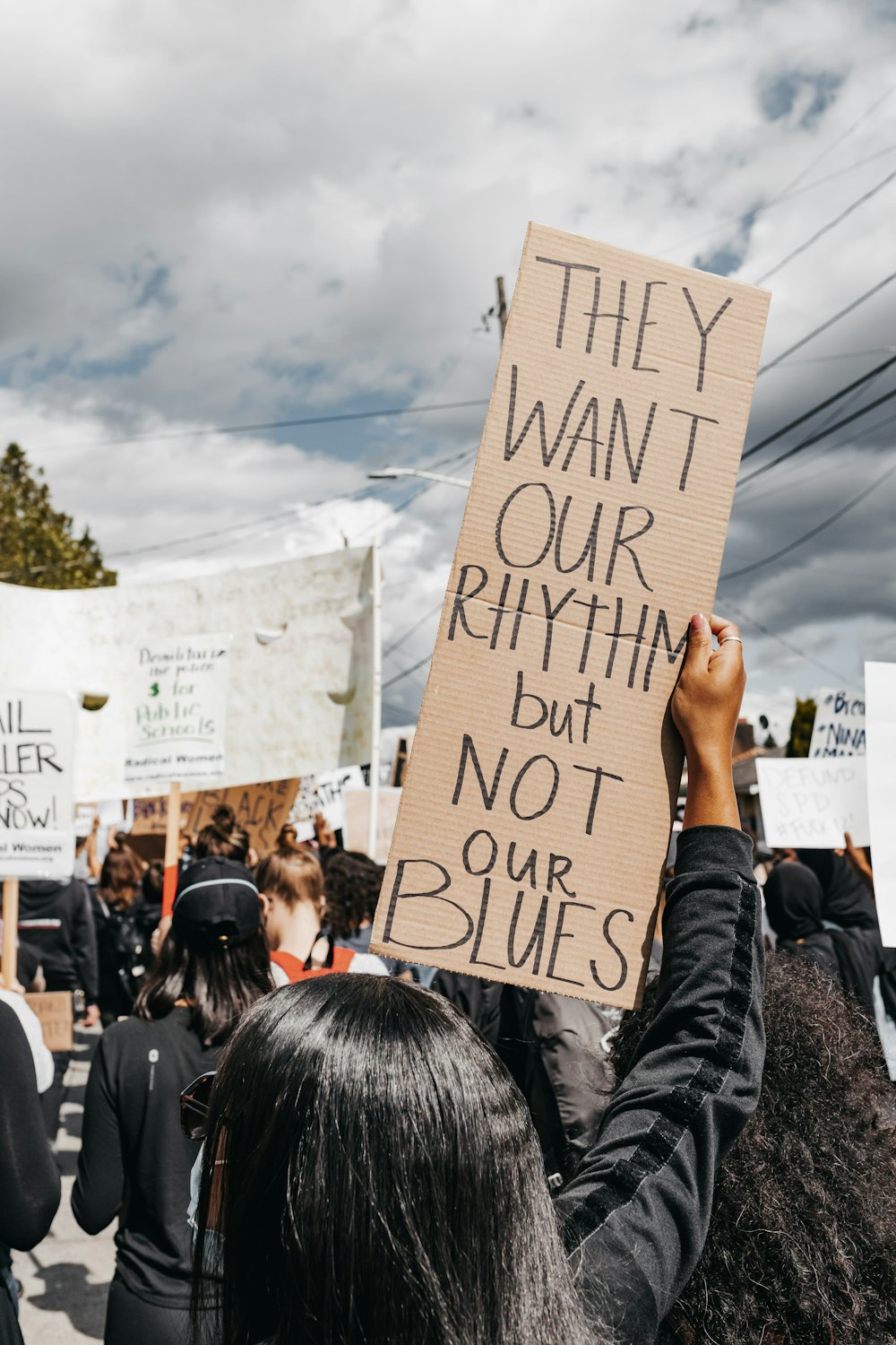 people holding white printer paper during daytime